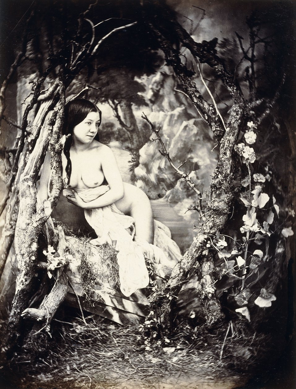 En halvnaken kvinne blant trær, ca. 1850-1860-tallet av Auguste Belloc
