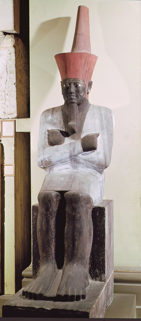 Statue av Mentuhotep II, tronet og iført den røde kronen av Nedre Egypt, hentet fra Mortuary Temple of Mentuhotep II, ved Deir el-Bahri, Middle Kingdom (malt sandstein) av Egyptian 11th Dynasty