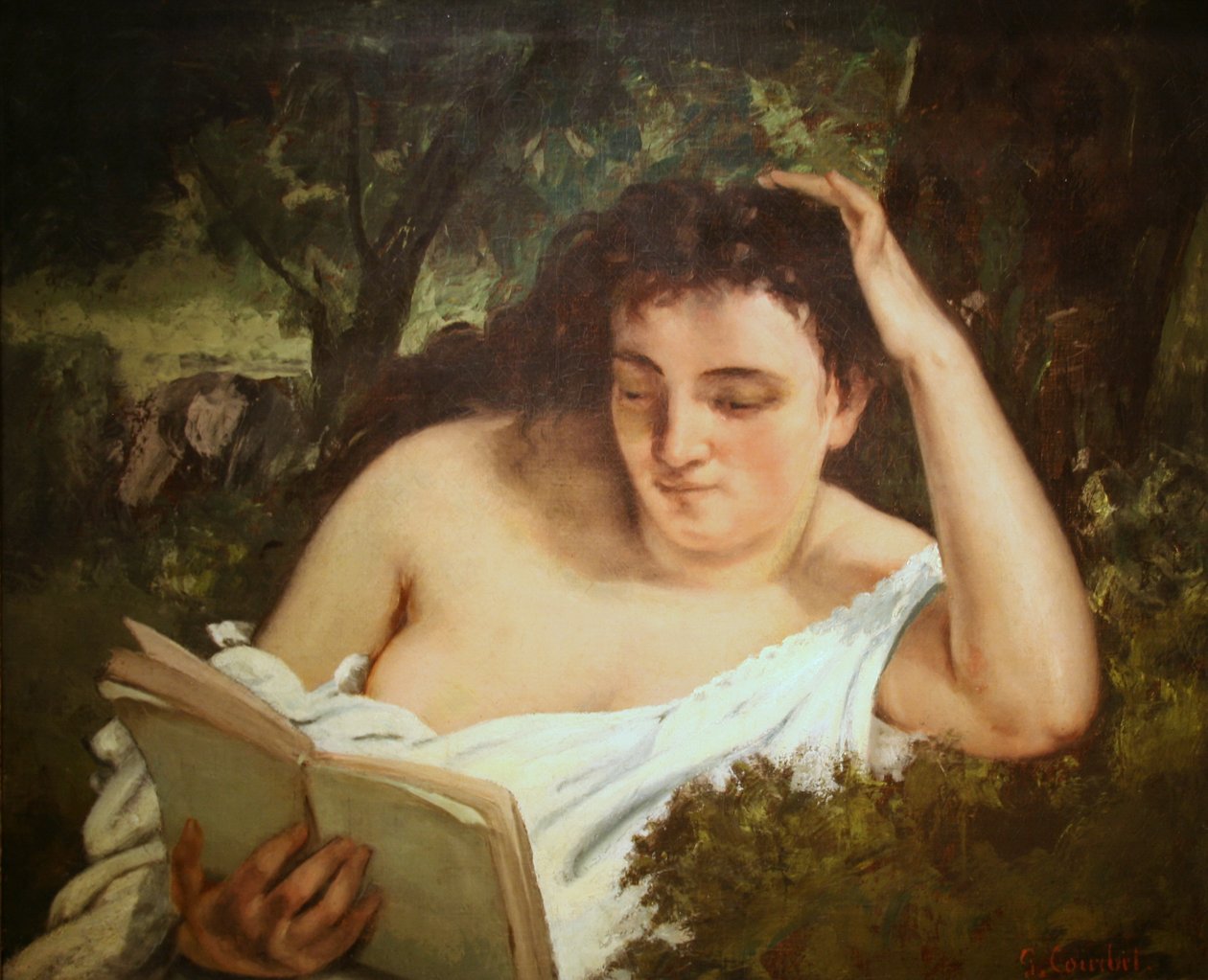 En ung kvinne som leser av Gustave Courbet