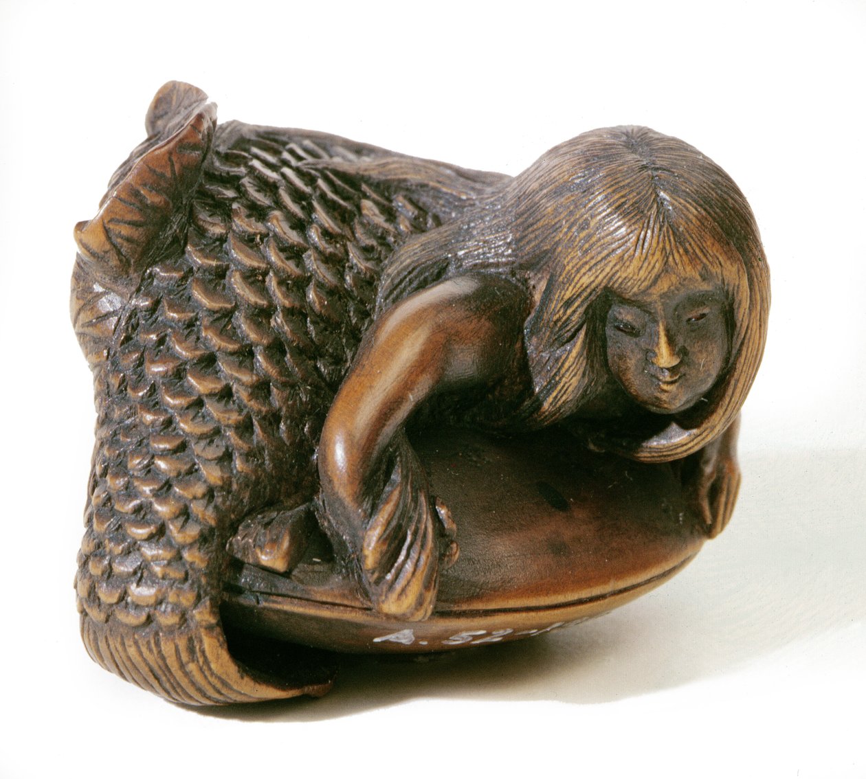 Netsuke skåret i form av en havfrue av Japanese School