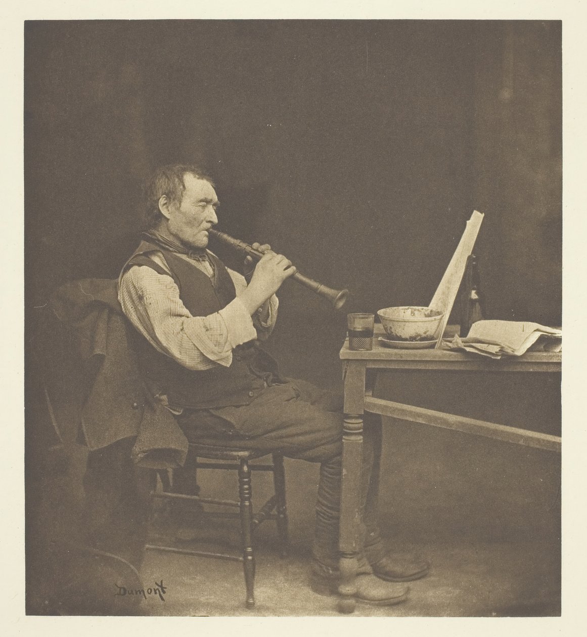 Klarinettspiller, ca. 1897. av John E. Dumont
