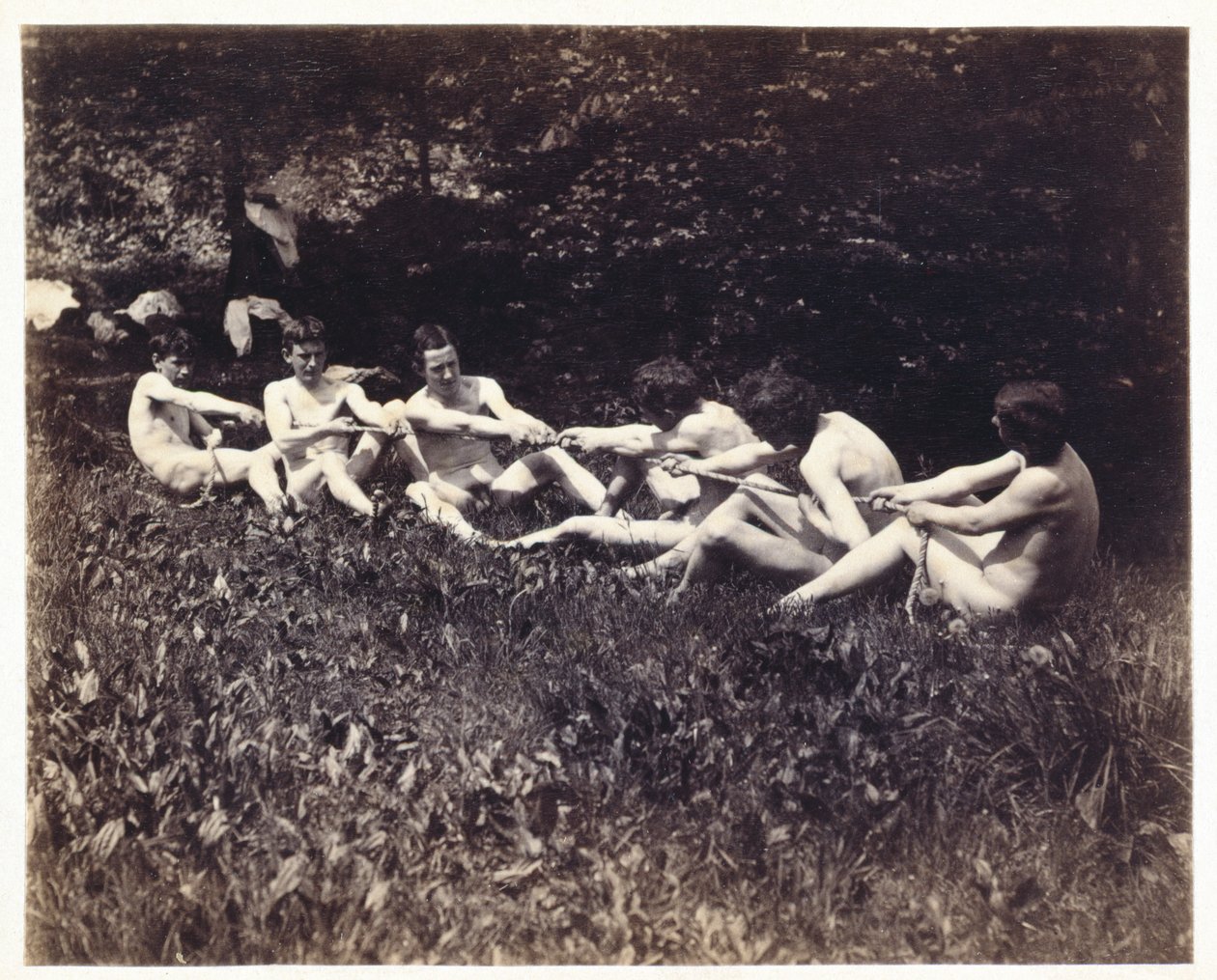 Mannlige nakenbilder i en sittende dragkamp, ca. 1883 (albumintrykk) av Thomas Eakins