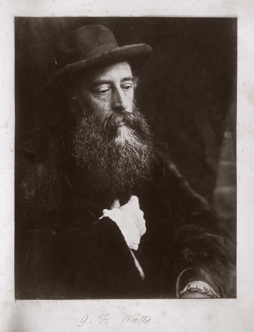 G F Watts med hatt