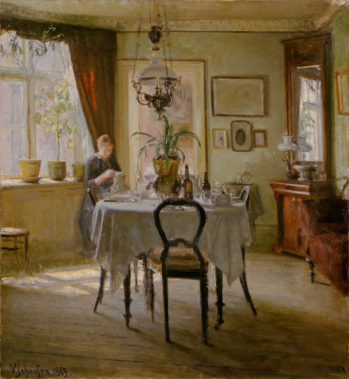 Sollys i spisestuen, 1889 av Viggo Johansen