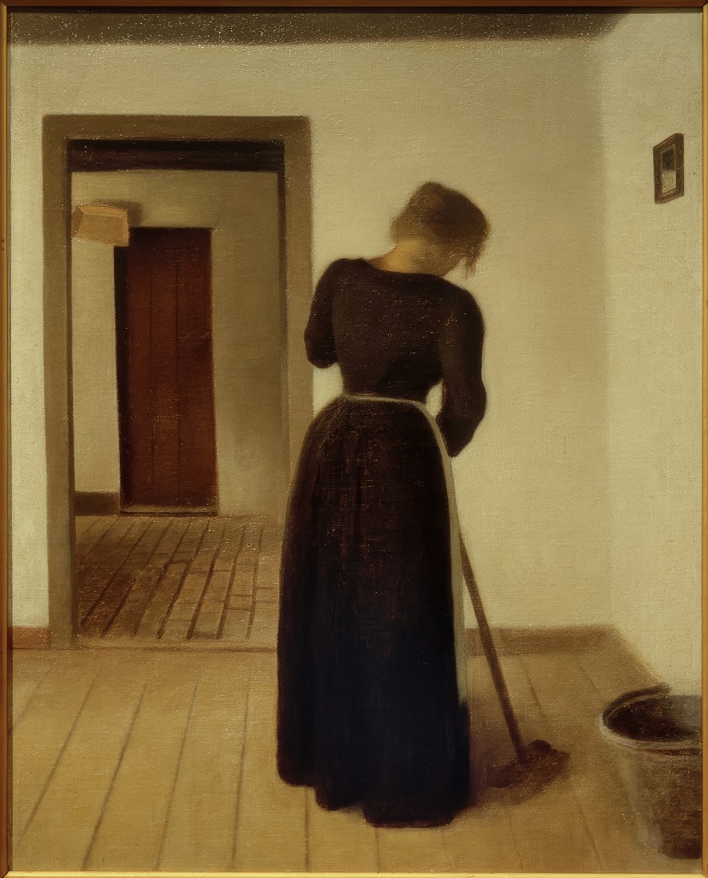 Interiør med en ung kvinne som feier av Vilhelm Hammershoi