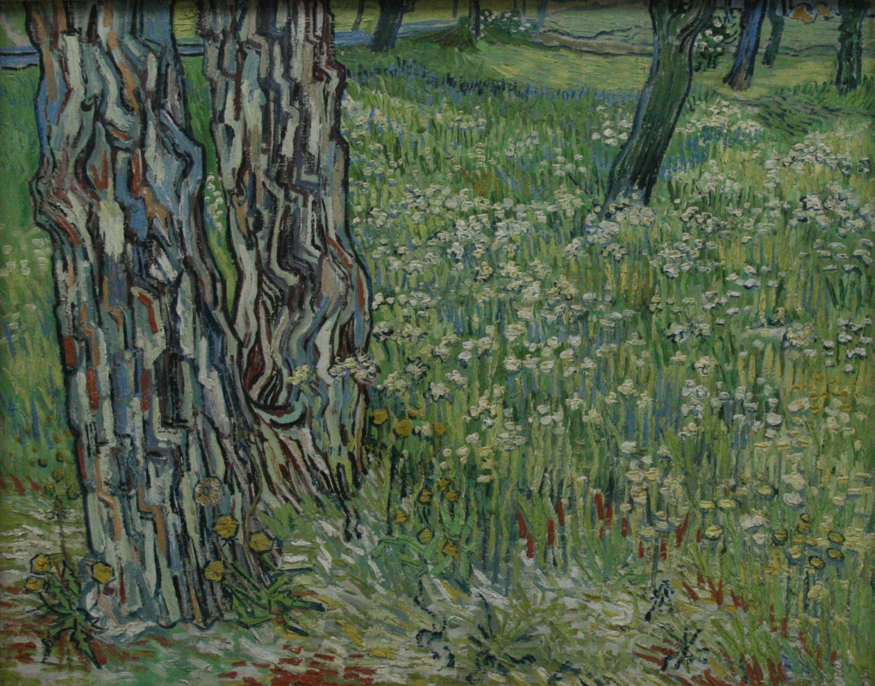Trestammer i gresset av Vincent van Gogh