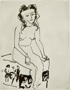 Sitter naken kvinne