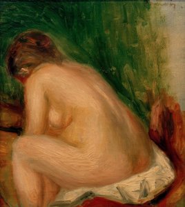 Naken kvinne sitter